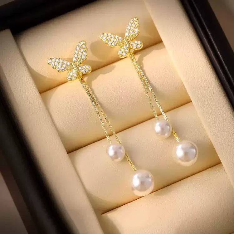 Solenne Wing Pearl Drop Earrings