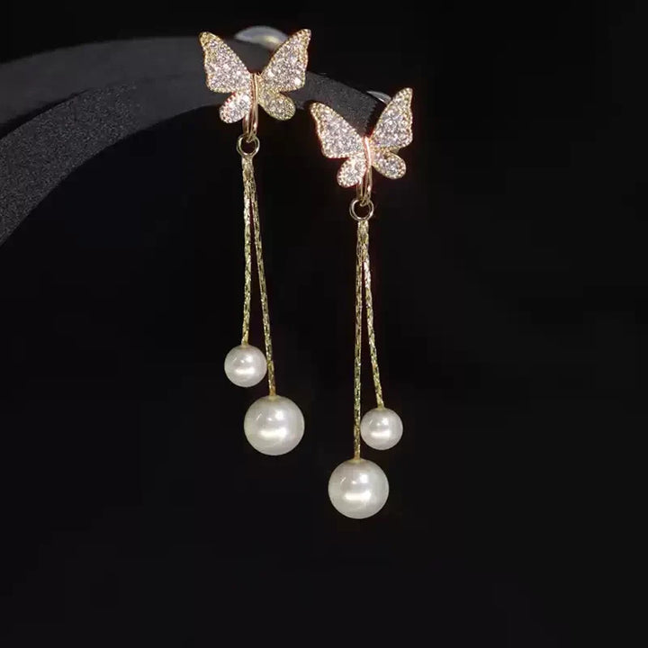 Solenne Wing Pearl Drop Earrings