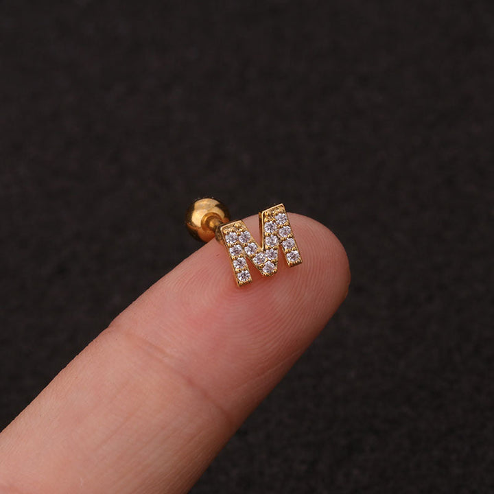 Letter earrings with zirconias and ball lock in 18 karat gold-plated stainless steel
