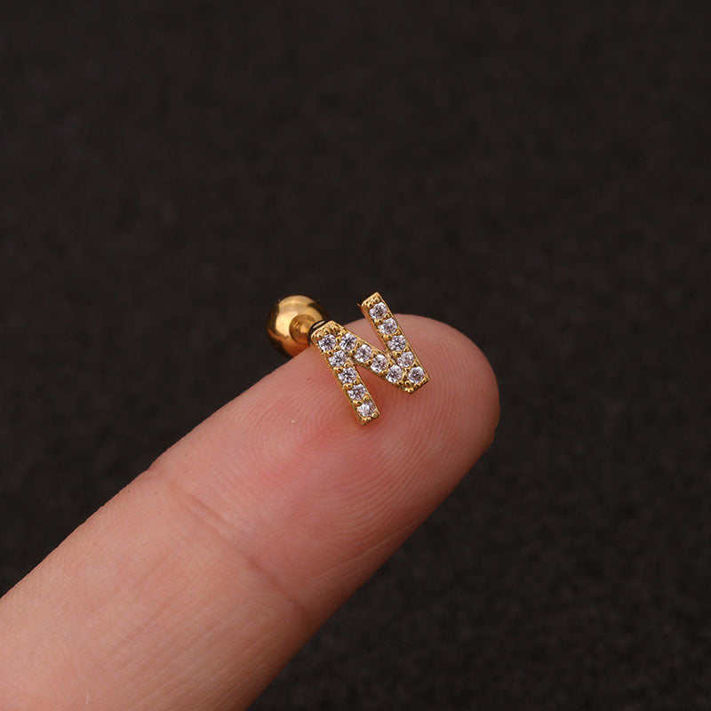 Letter earrings with zirconias and ball lock in 18 karat gold-plated stainless steel