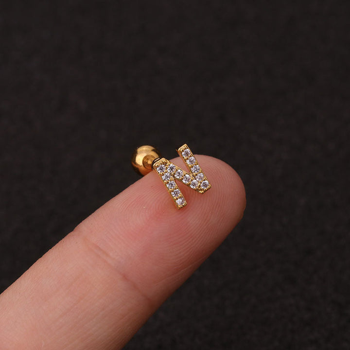 Letter earrings with zirconias and ball lock in 18 karat gold-plated stainless steel