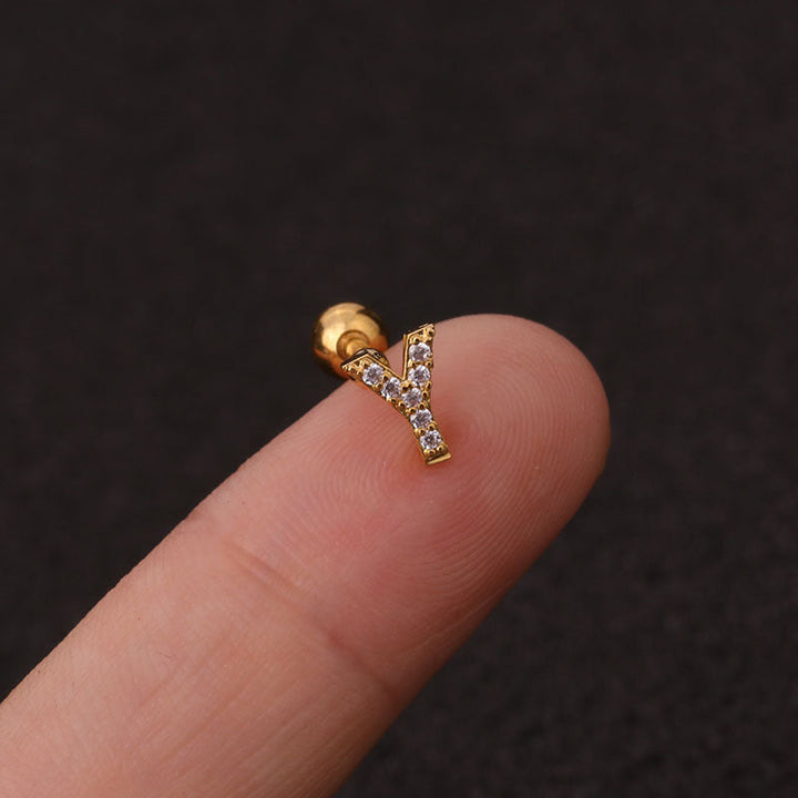 Letter earrings with zirconias and ball lock in 18 karat gold-plated stainless steel