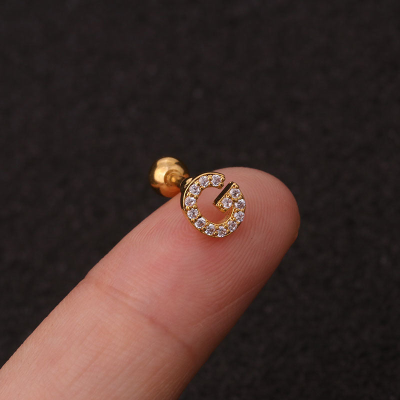 Letter earrings with zirconias and ball lock in 18 karat gold-plated stainless steel