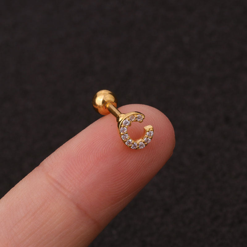 Letter earrings with zirconias and ball lock in 18 karat gold-plated stainless steel