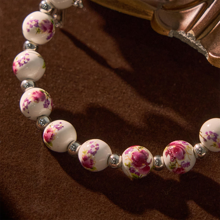 Christianartworkshop Multi-color Floral Ceramic Stretch Bracelet with Miraculous Medal & Crucifix: Subtle Faith Elegance