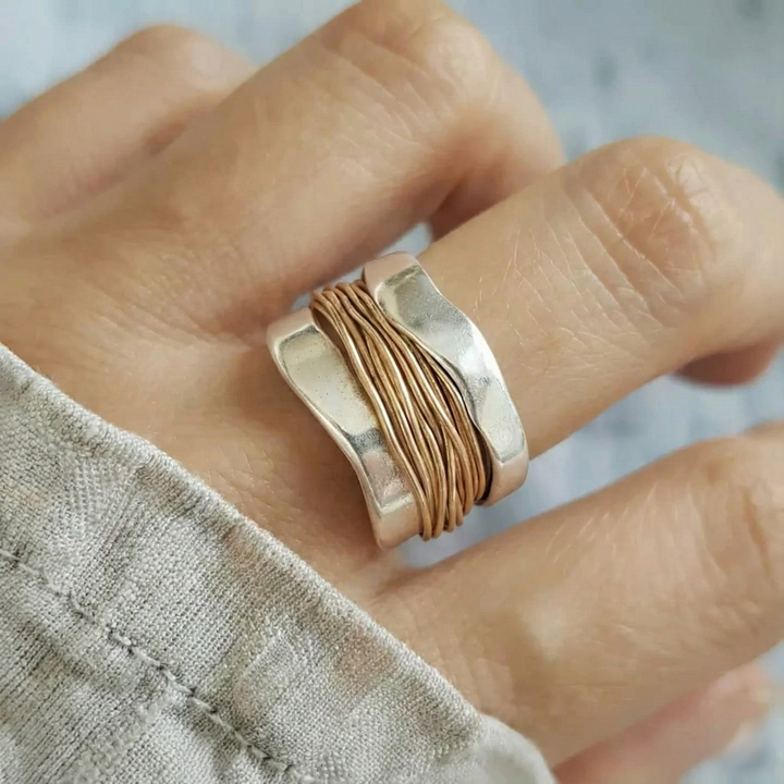 Silver ring with golden threads