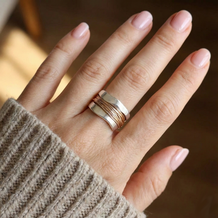 Silver ring with golden threads