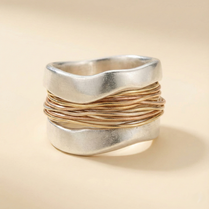 Silver ring with golden threads