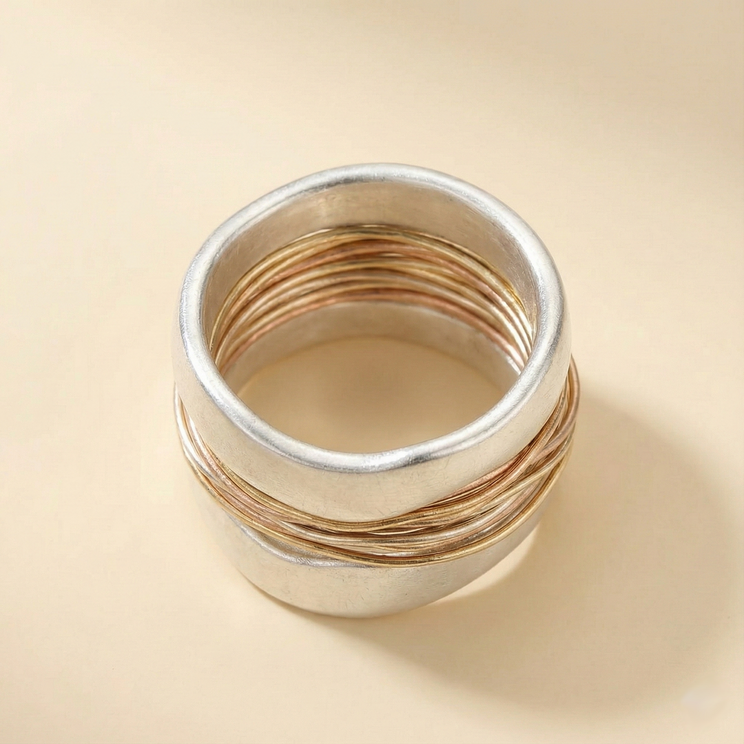 Silver ring with golden threads