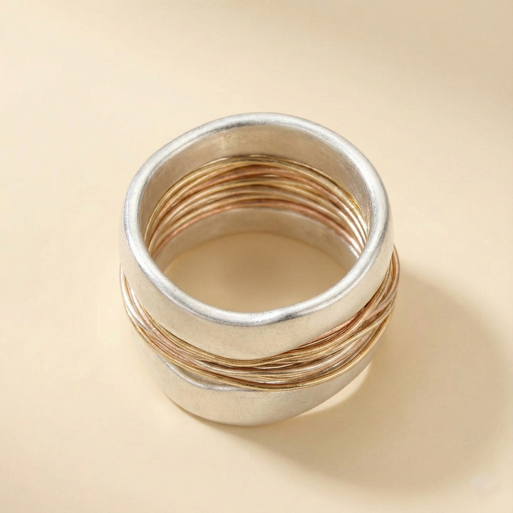 Silver ring with golden threads