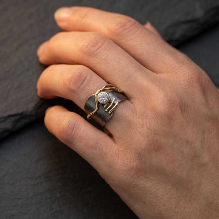Dark ring with vintage zircon