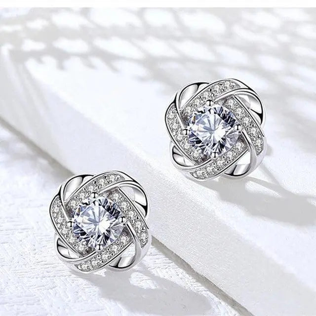 Crystal earrings with golden spiral design