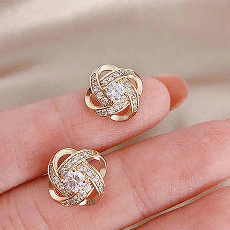 Crystal earrings with golden spiral design