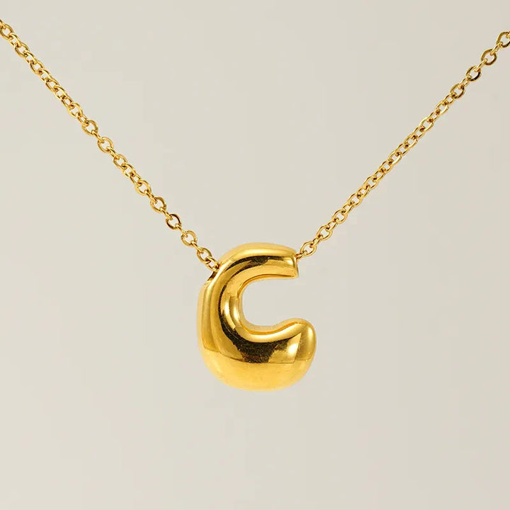 Necklace with balloon letters in 18 karat gold-plated stainless steel
