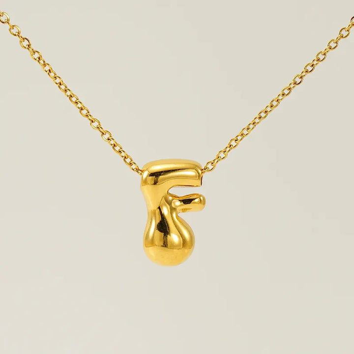 Necklace with balloon letters in 18 karat gold-plated stainless steel