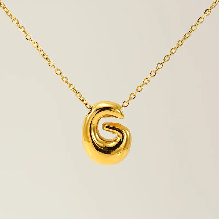 Necklace with balloon letters in 18 karat gold-plated stainless steel