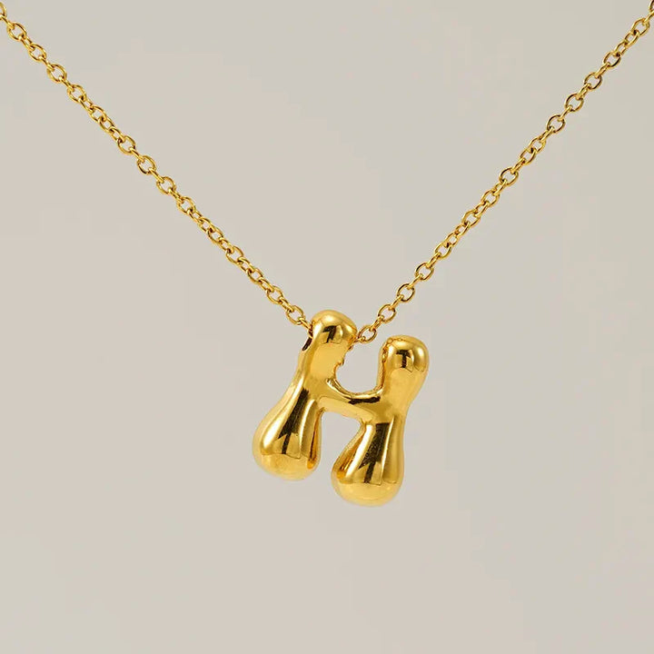 Necklace with balloon letters in 18 karat gold-plated stainless steel