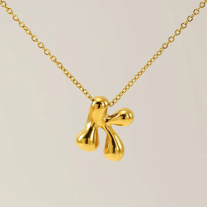 Necklace with balloon letters in 18 karat gold-plated stainless steel