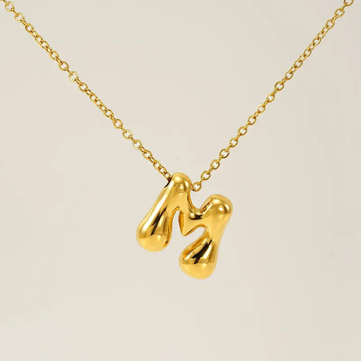 Necklace with balloon letters in 18 karat gold-plated stainless steel