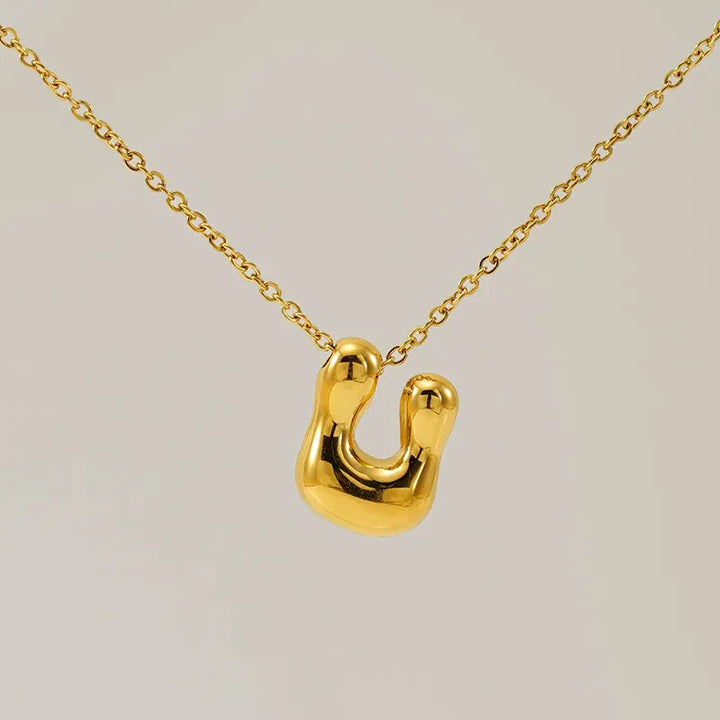 Necklace with balloon letters in 18 karat gold-plated stainless steel