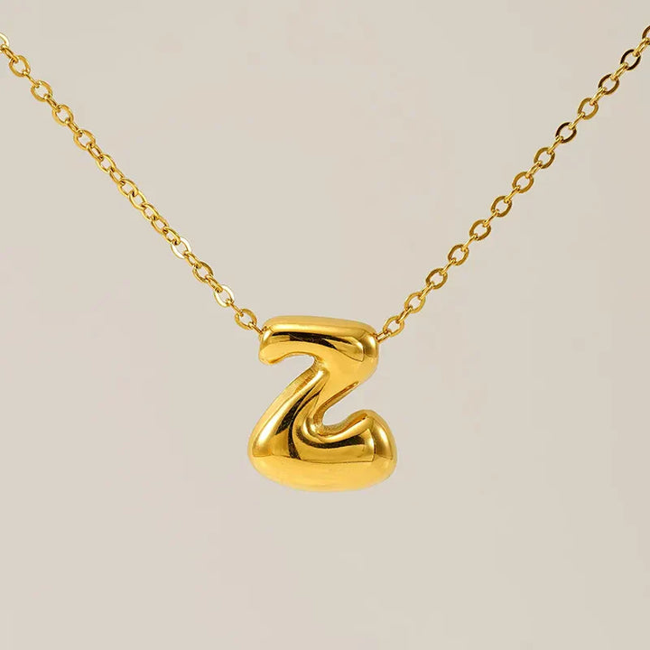 Necklace with balloon letters in 18 karat gold-plated stainless steel